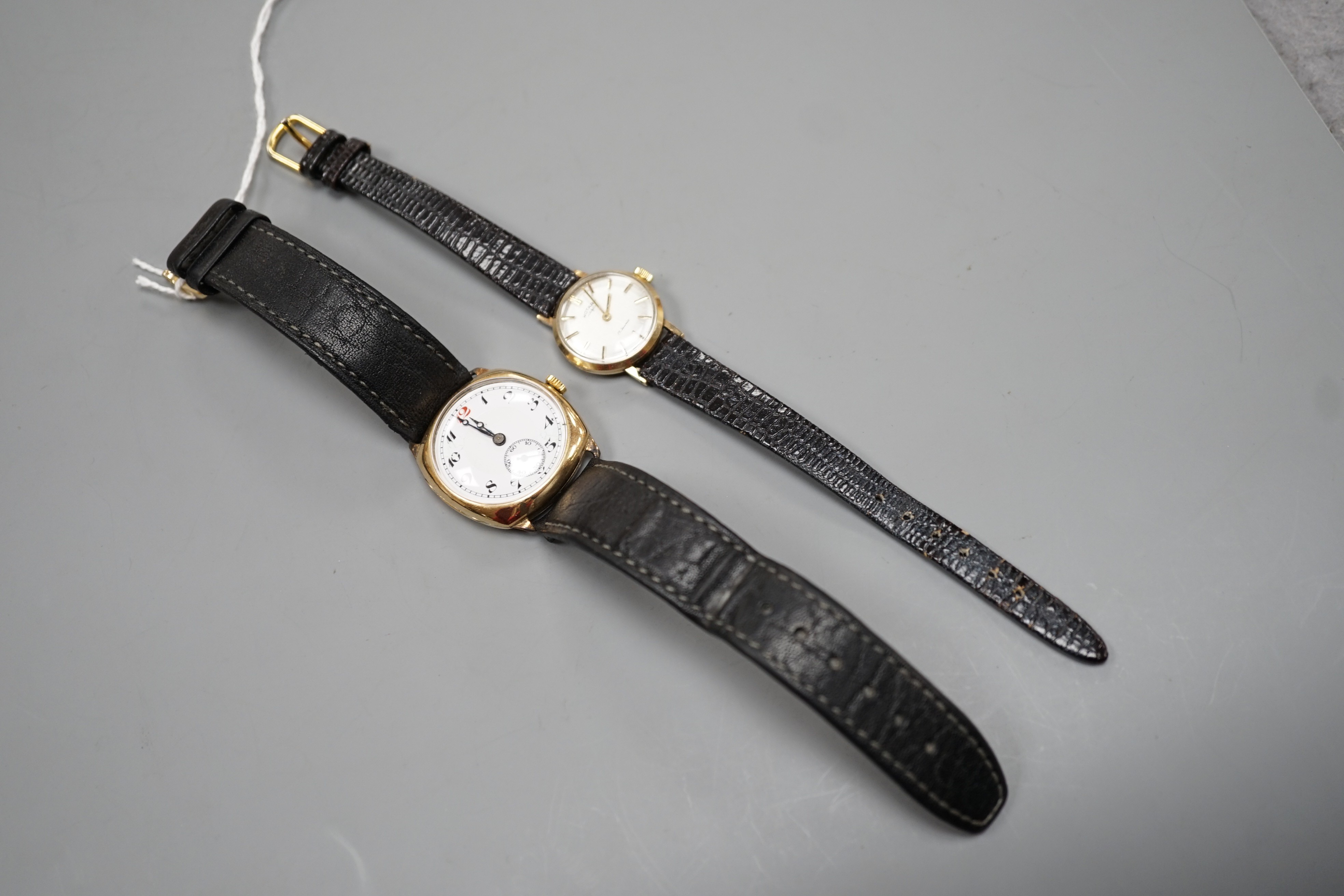 A gentleman's 1930's 9ct gold manual wind wrist watch, with Arabic dial and subsidiary seconds, together with a lady's yellow metal Rotary manual wind wrist watch, both on associated leather straps.